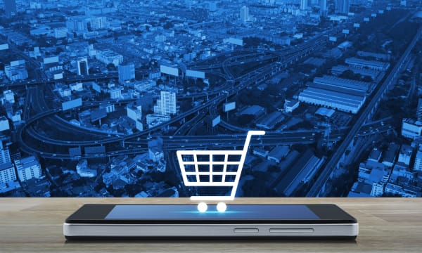 virtual shopping cart placed on mobile phone